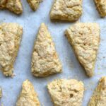 Carrot ginger scones in alternating rows on top of parchment paper